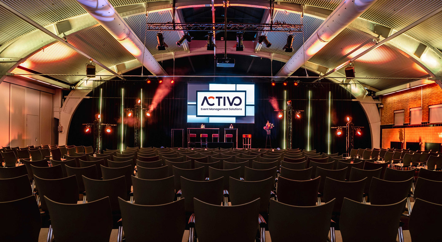 Full event hall with participants
