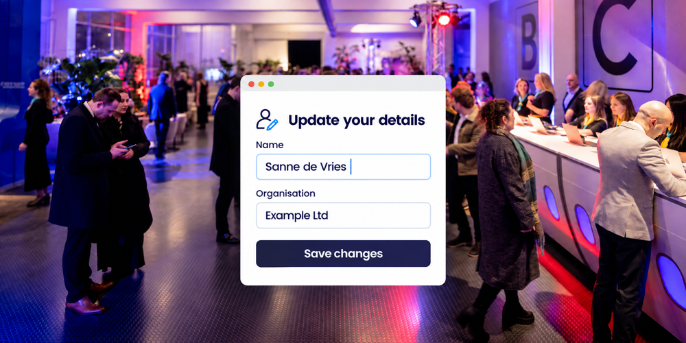 Attendees at an event reception desk with a form to update their name and organisation and save changes
