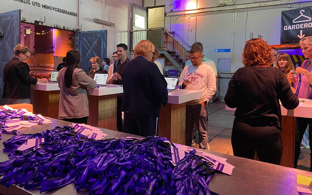 Hostesses at the access control point, with lanyards in the foreground.